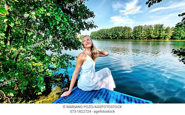 Woman on the pier in Lake Avral, Kirillovka, Samara Region, Russian Federation
