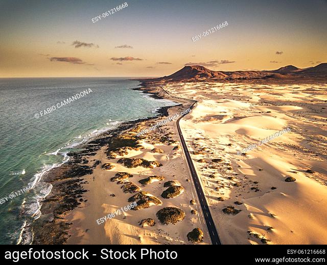 Aerial landscape view with coastline and beaches on blue ocean water and asphalt road to travel and enjoy freedom - scenic place for summer holiday vacation in...