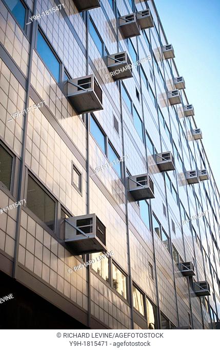 Air conditioners sprout from windows in a building in New York Attractive pricing and smuggling of the illegal coolant HCFC-22 freon is making it difficult to...