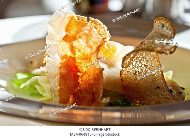 Italy, South Tirol, Vinschgau, Obervinschgau, Mals, Schleis, inn 'Zum Goldenen Adler' of the family Agethle, halibut fillet in bacon sauce on salad hearts with...