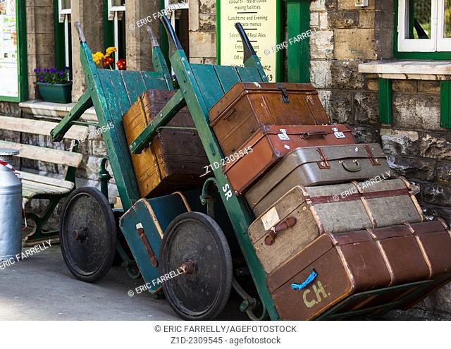 old fashioned luggage and porters trollies at Swanage Railway station Dorset England UK