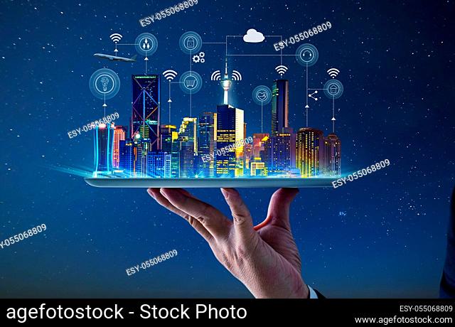 Waiter hand holding an empty digital tablet with Smart city with smart services and icons, internet of things, networks and augmented reality concept