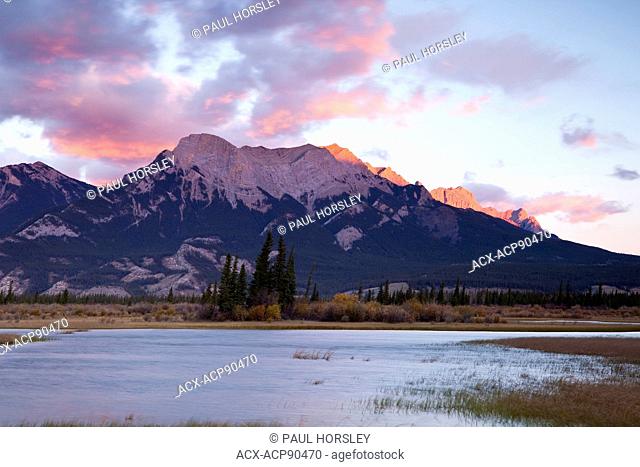 Rocky Mountains at sunset with Athabasca River in the foreground, Jasper National Park, Alberta, Canada