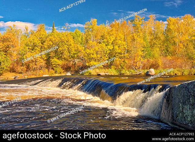 Whiteshell River flows into White Lake at Rainbow Falls in autumn Whiteshell Provincial Park Manitoba Canada