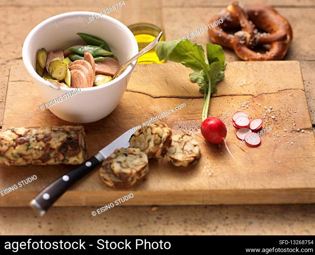 Bavarian sausage salad with mini pretzel dumplings