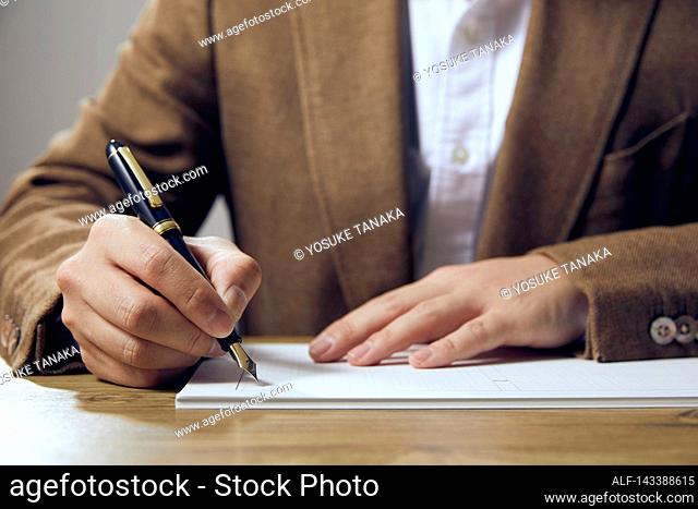 Man writing on paper