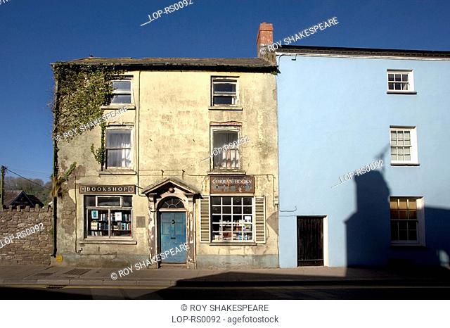 Wales, Carmarthenshire, Laugharne, A view of Corran Book Shop attached to a pale blue building. Laugharne is an ancient township on the river Taf