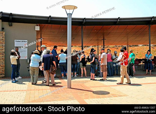 Tourists gathered at entrance of Cradle of Human Kind by the Ticket Office, Maropeng, Gauteng, South Africa