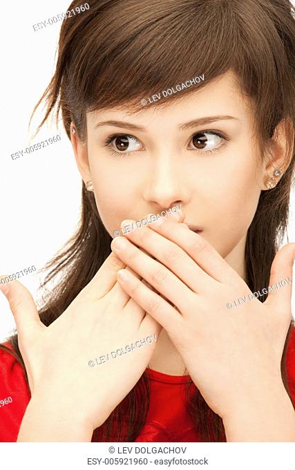 bright closeup portrait picture of teenage girl with palms over mouth