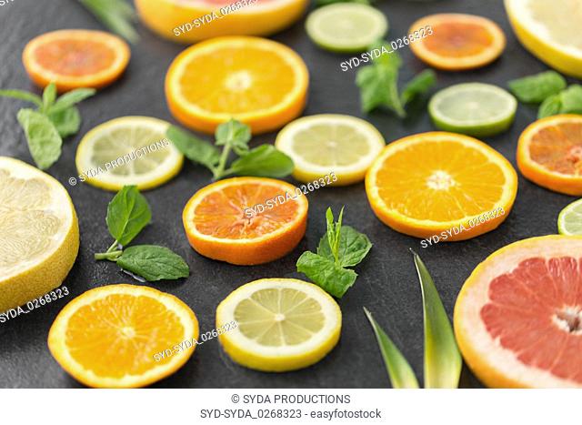 close up of grapefruit, orange, pomelo and lime