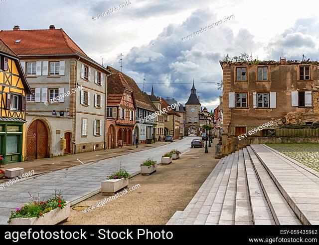 Street and historic gate in Rosheim, Alsace, France