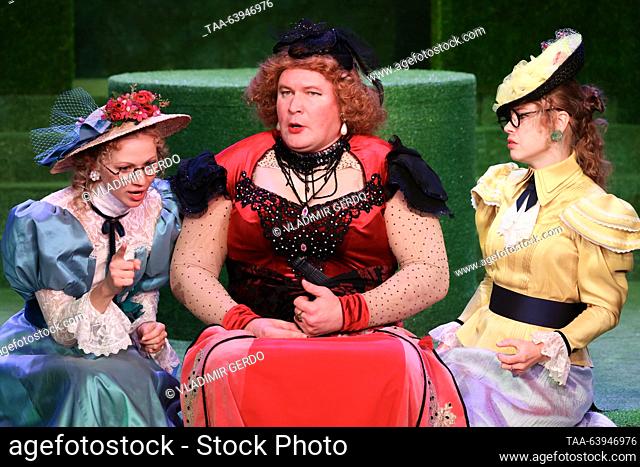 RUSSIA, MOSCOW - OCTOBER 26, 2023: Actors Yekaterina Lisitsyna as Kitty, Ivan Mamonov as Lord Fancourt Babberley, and Olga Grudyayeva (L-R) as Amy perform...