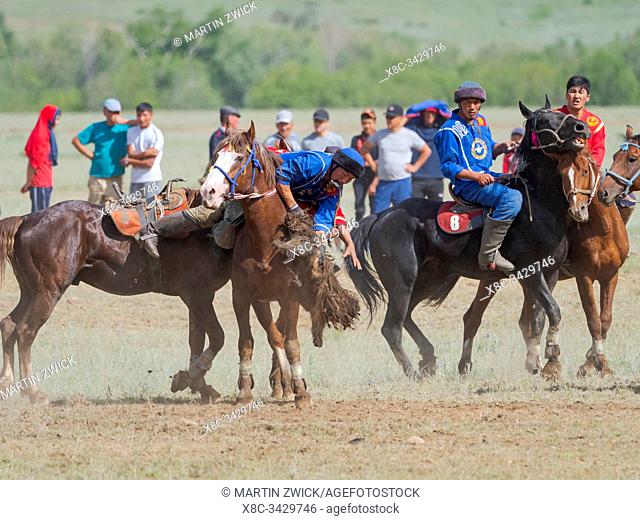 Kok Boru (Buzkashi), traditional equestrian team sport. Festival on the Suusamyr plain commemorating Mr Koshkomul, a sportsman and folk hero of the last century