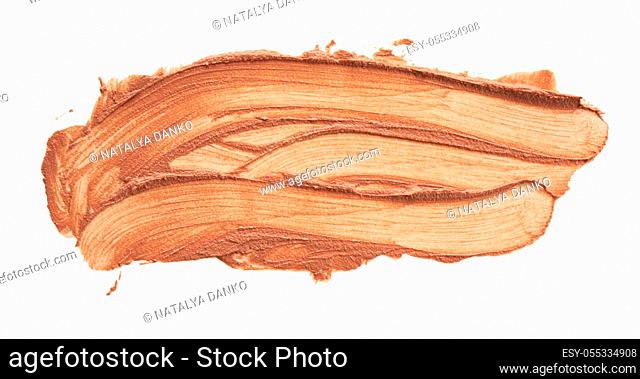 swatch of brown lipstick, smear isolated on white background, close up