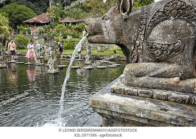 Statue in the Tirta Gangga water palace, a former royal palace. Karangasem regency, Bali, Indonesia