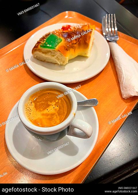 Cup of coffee and Three King's cake serving. Spain