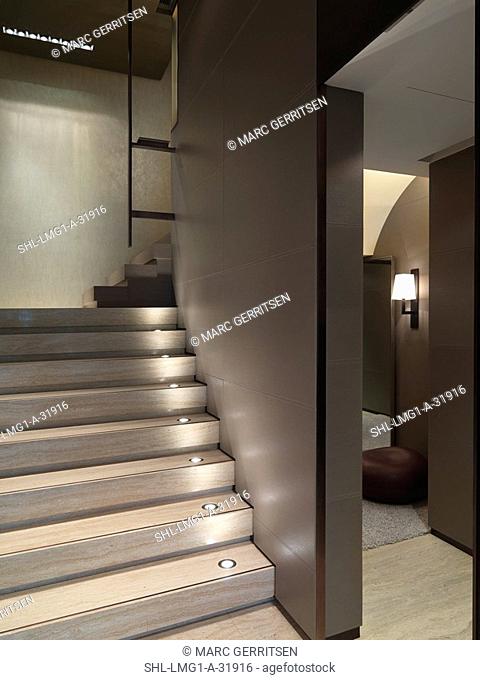 Wooden staircase with built in recessed lights