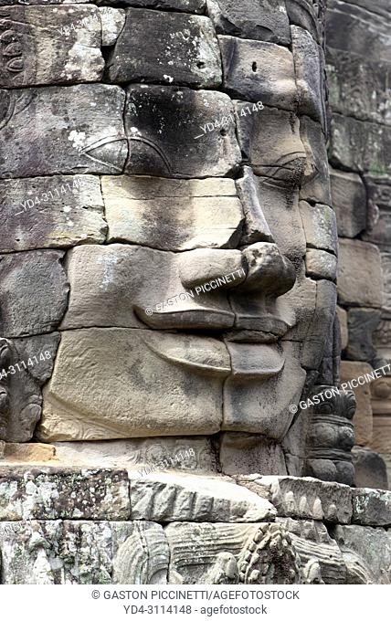 Stone sculptures, faces on the Bayon Temple in Angkor Thom, Angkor Temple Complex, Siem Reap, Cambodia, Southeast Asia. Bayon is a well-known and richly...