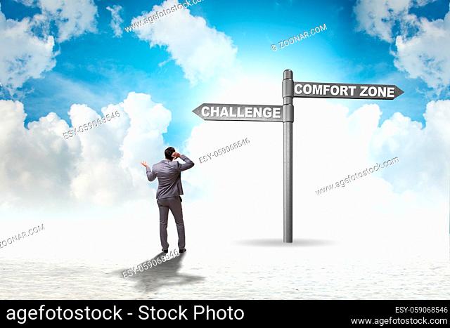 Businessman choosing between leaving the comfort zone or not