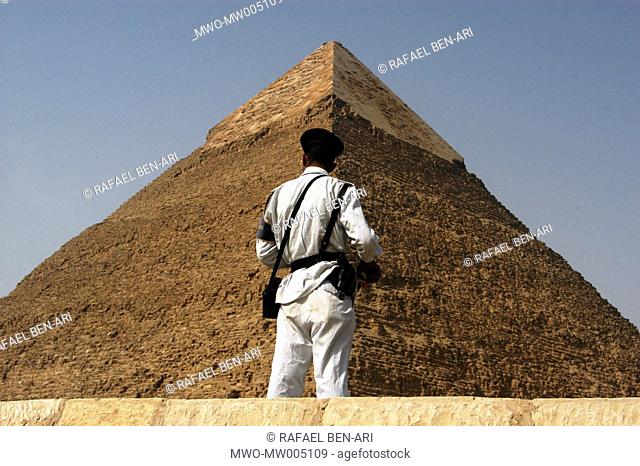 An Egyptian tourist police guards the pyramid of Khafre For some 45 centuries, the great pyramids of Giza, Cairo have stood the test of time