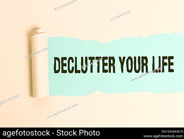 Conceptual hand writing showing Declutter Your Life. Concept meaning To eliminate extraneous things or information in life