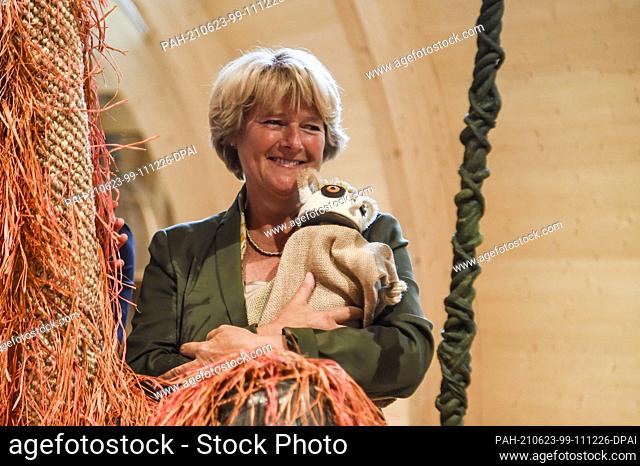 23 June 2021, Berlin: Minister of State for Culture Monika Grütters (CDU) stands with a self-made lemur in ANOHA after an online pk