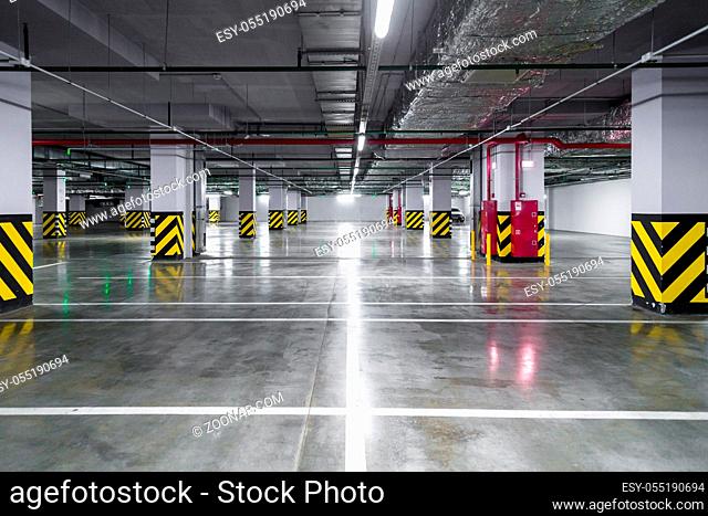 Empty underground parking garage. industrial background
