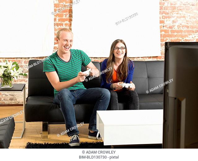 Couple playing video games together