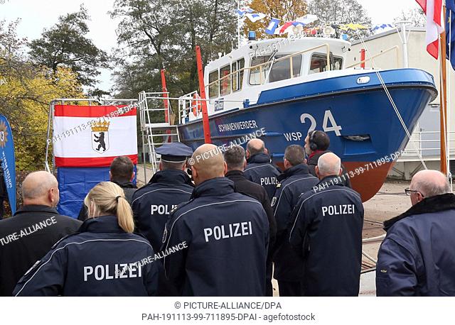 13 November 2019, Berlin: Police officers are following the baptism of a new boat named ""Schwanenwerder"" by the Berlin Water Police