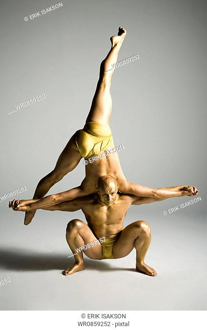 Two male acrobats performing