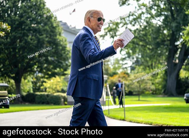 United States President Joe Biden walks on the South Lawn of the White House before boarding Marine One in Washington, DC, US, on Tuesday, Aug
