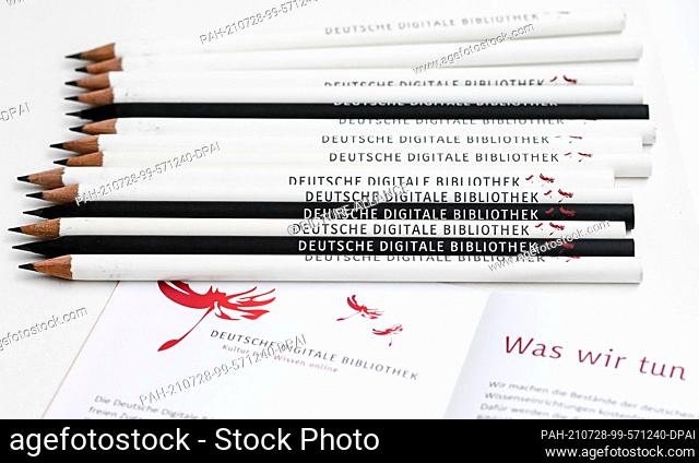21 July 2021, Berlin: Pencils with the logo of the German Digital Library (DDB) lie on a promotional flyer of the institution
