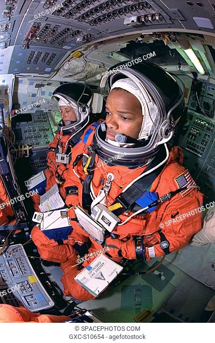 07/23/1997 -- STS-85 Payload Commander N. Jan Davis left and Mission Specialist Robert L. Curbeam, Jr., go through countdown procedures aboard the Space Shuttle...