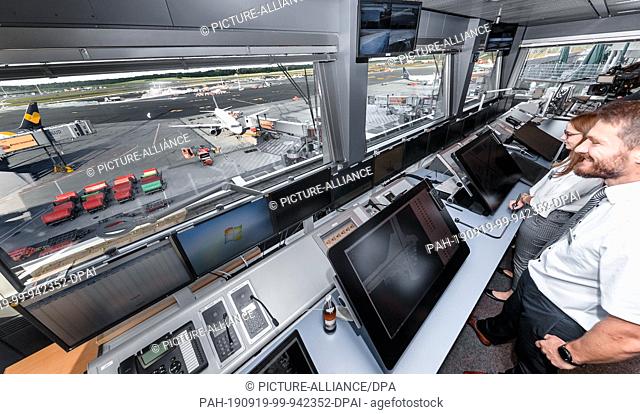 19 September 2019, Hamburg: Apron controllers work in a research and test tower at Hamburg Airport. The German Aerospace Center (DLR) is testing solutions to...