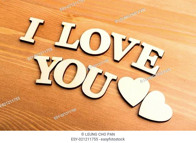 Vintage wooden letters forming with phrase I Love You