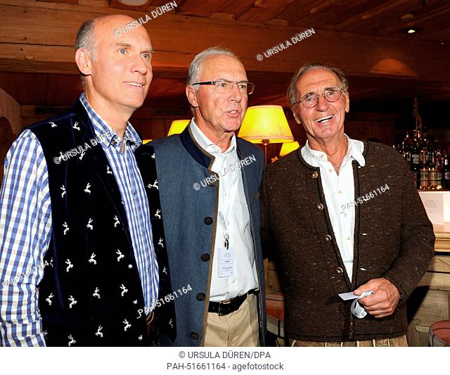 Soccer legend Franz Beckenbauer (C), his son Thomas (L) and his brother Walter are pictured during the gala on occasion of 'Camp Beckenbauer' in Going, Austria