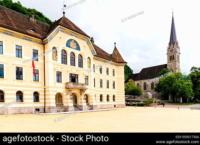 Vaduz, FL / Liechtenstein - 16 June 2020: view of the city center of Vaduz with the city hall and the St. Florin church