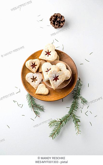 Vanilla cookies, heart-shaped, marmelade and powdered sugar