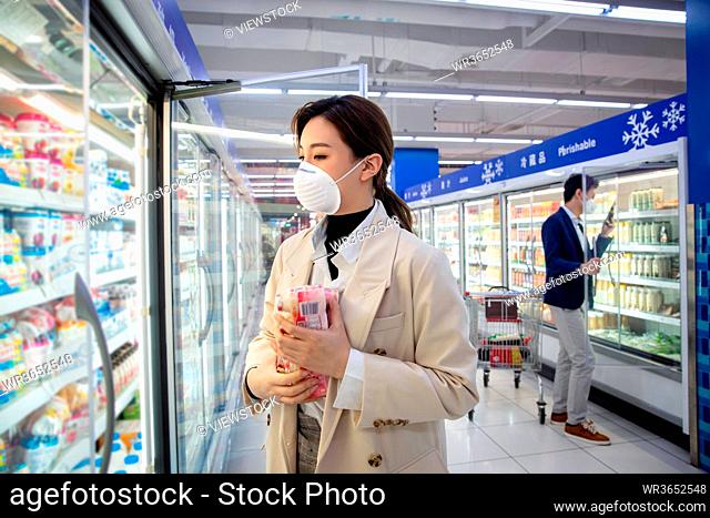 Young women shopping in the supermarket