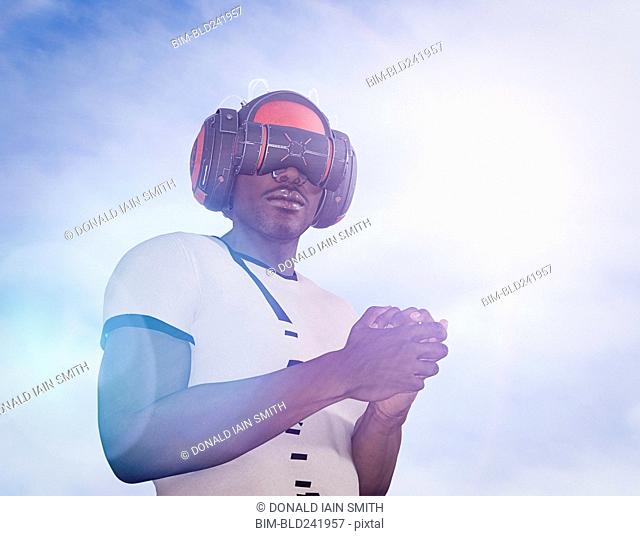 Strong man wearing virtual reality helmet