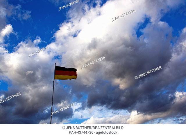 A German flag flutters in the wind on the Baltic Sea island of Poel in the port of Timmendorf,  Germany, 28 October 2013