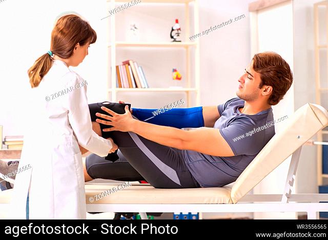 Young male patient visiting female doctor traumatologist