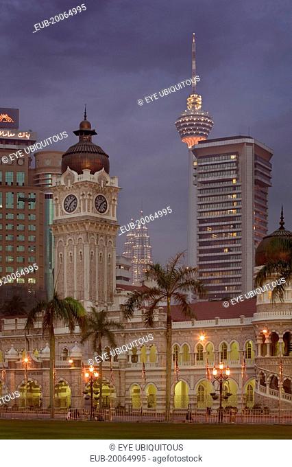 City centre skyline from Merdeka Square with The Sultan Abdul Samad Building in the foreground The Menara Kuala Lumpur and Petronas Towers behind