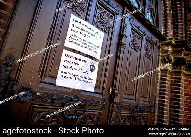 22 March 2020, Lower Saxony, Oldenburg: Notes on a door of the Lambertikirche refer to the ban on church services. Since all church services are prohibited in...