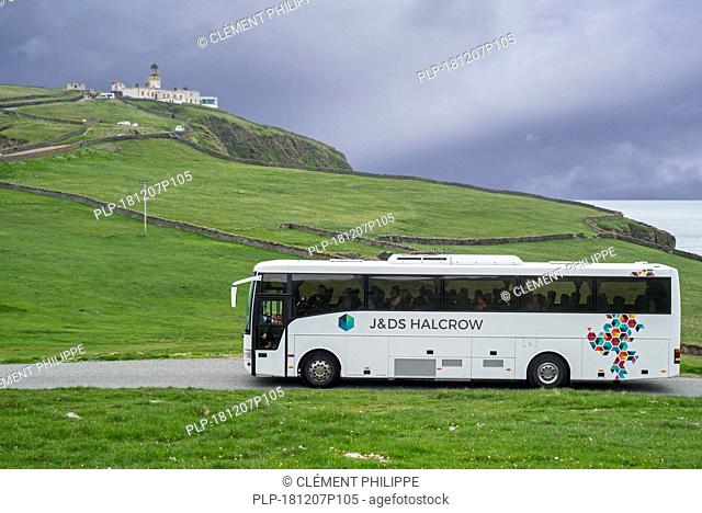 J&D S Halcrow bus driving tourists to Sumburgh Head Lighthouse at the southern tip of Mainland of Shetland, Scotland, UK