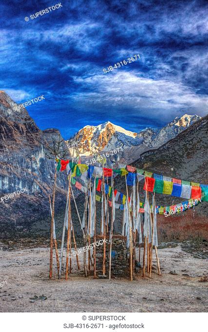 Prayer flags at Riphuk Kharka, with the peak of Hongku Chull in the distance
