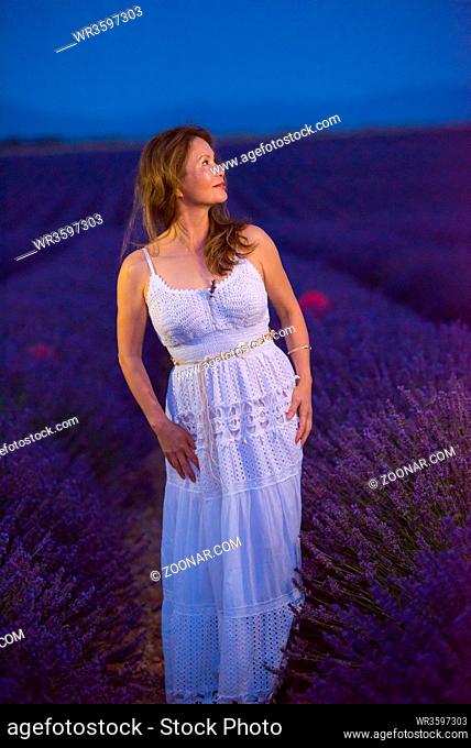 portrait of and asian woman in lavender flower field in night