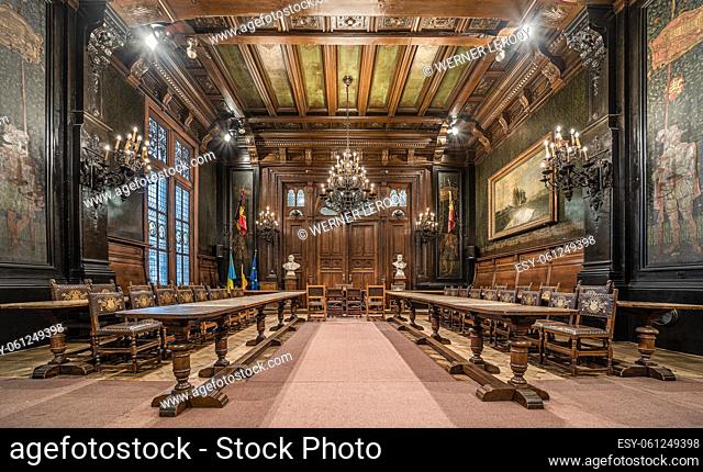 Anderlecht, Brussels Capital Region - Belgium View over the vintage council chamber with wooden decoration, chandeliers and stained glass