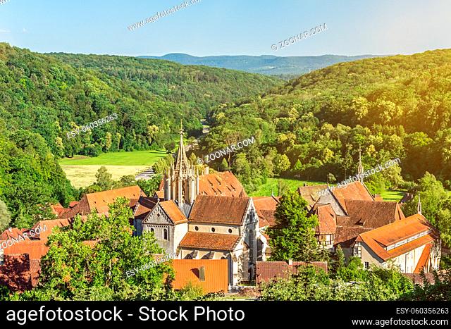 Scenic ancient monastery of Bebenhausen surrounded by forest in Southern Germany on a sunny evening