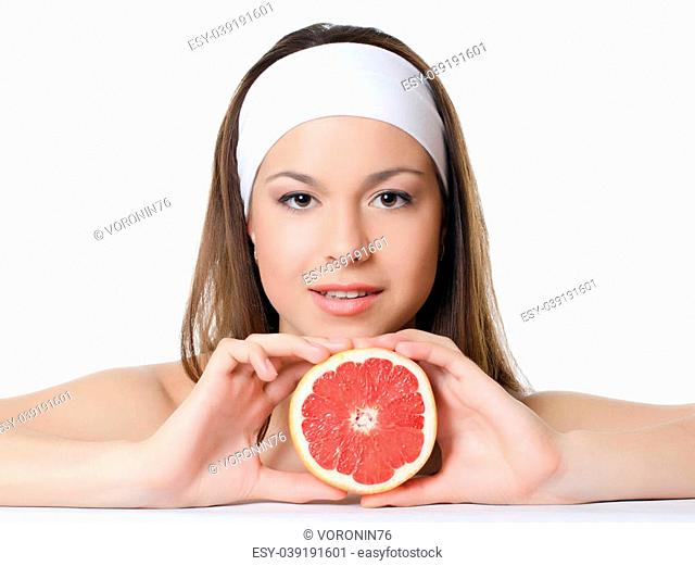 The beautiful woman with a grapefruit isolated
